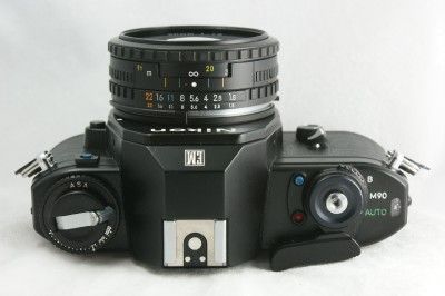 Nikon EM camera with 50mm 11.8 series E lens  