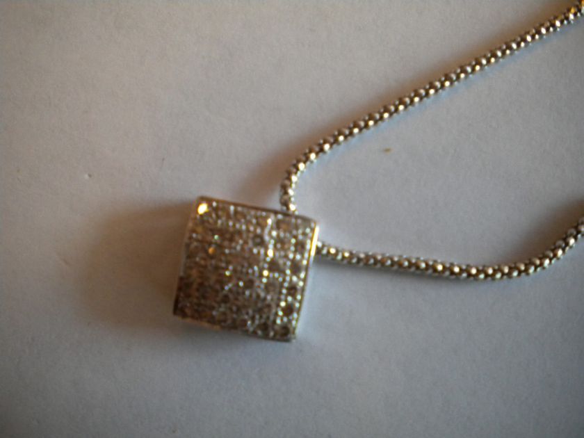   .75 CARAT PAVE SET DIAMOND PENDANT IN 14 KARAT WHITE GOLD.  